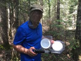  Public Health Agency of Canada scientist collecting mosquitoes in the field.
