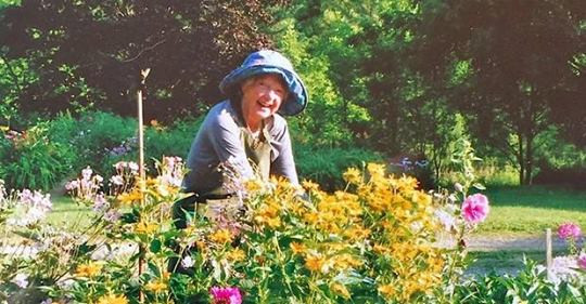 Eluned tending to flowers in her garden, now the MacMillan Farm nature reserve in the city of Vaughan, Ontario