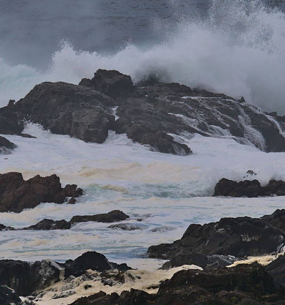 Waves crash on a rocky shore