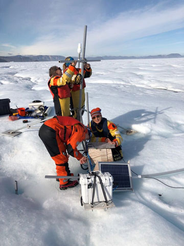 Research safety: Dr. Mona Nemer assists in dismantling scientific equipment used in an experiment on an ice island in Canada’s Arctic.