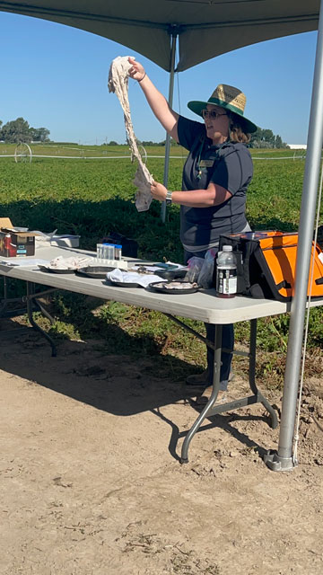 Dr. Linda Schott speaking at a field day in Idaho about soil testing that potato growers can do in their own fields to assess soil health