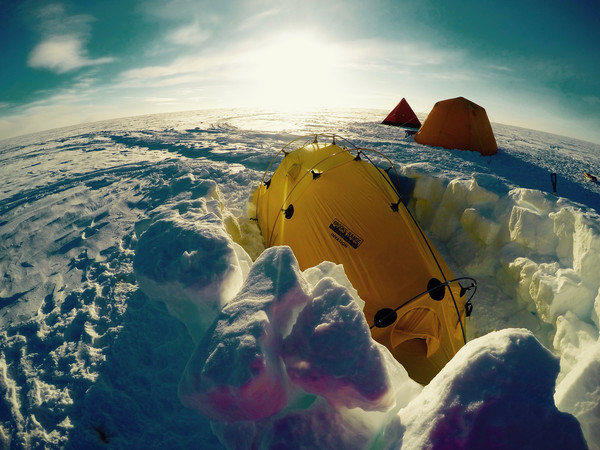 The Agassiz Ice Cap on Ellesmere Island is where the team will call home while ice coring in the North. My yellow tent, tucked neatly in the snow, is where I'll be camped out alongside two of my fellow researchers.