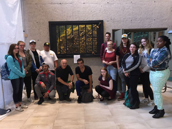 Spring 2017’s Oceans 11 class from J.L. Ilsley High School, with teacher Frank van Blacorn (centre-left), in front of replica seafloor artwork donated to the Bedford Institute of Oceanography