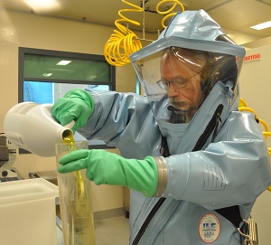 Scientist Greg Smith dons a positive pressure suit