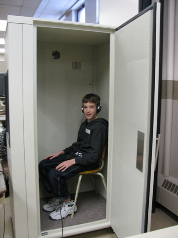 Researchers used portable sound booths such as this one to test hearing in teenagers.
