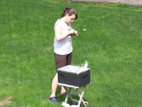 My stylish grade 11 self (check out those crocs) building a solar water pasteurizer over the summer.